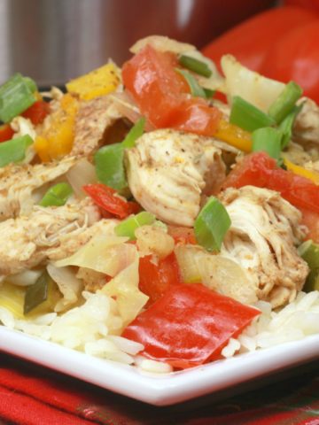 Jerk Chicken with red peppers over rice.